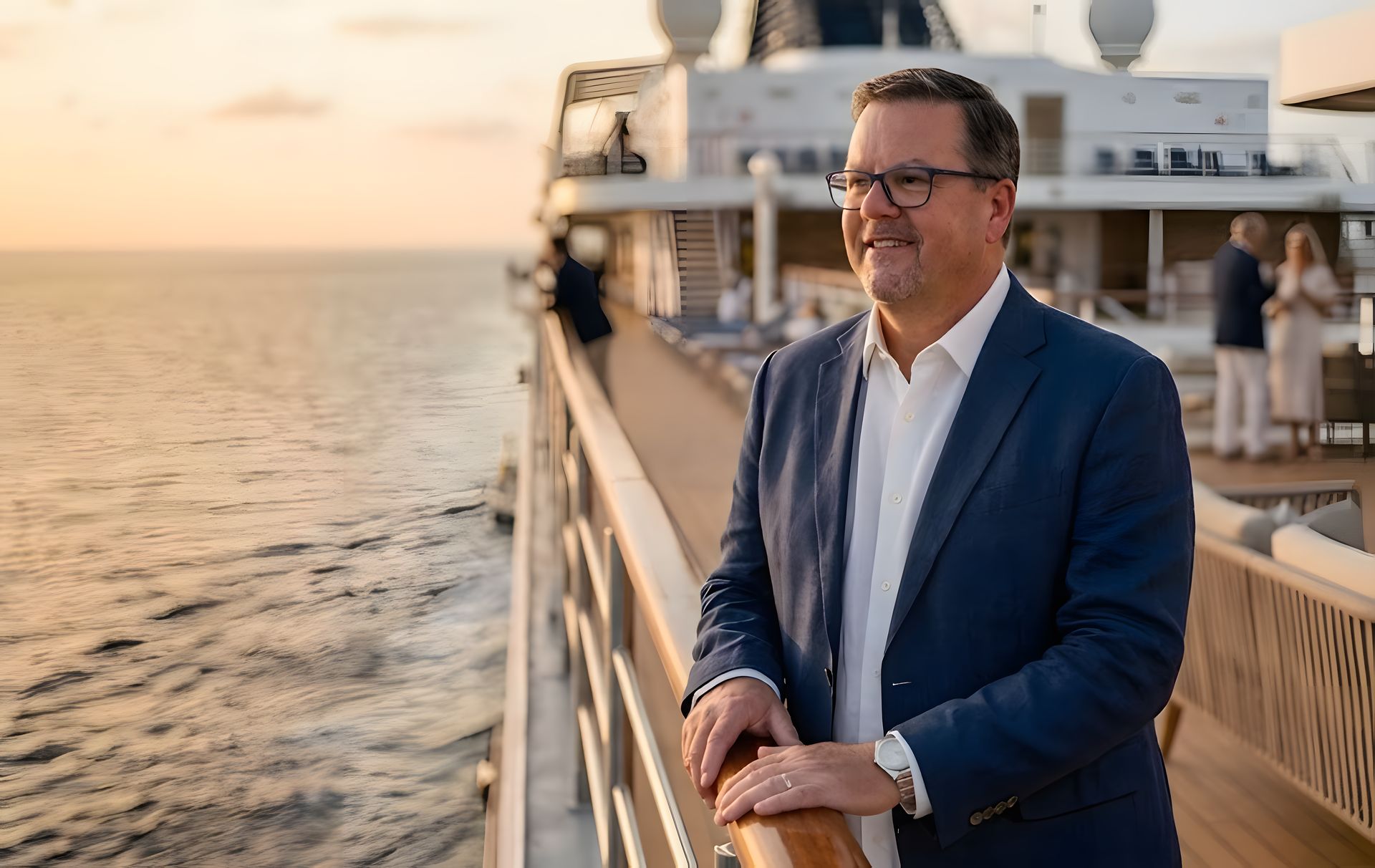 John Elder on a cruise ship deck at sunset